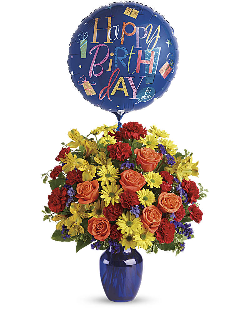 Fly Away Birthday Bouquet - Up, up and away! Take that special someone's birthday to new heights with this happy arrangement and mylar balloon. Bold primary colors and a deep blue vase make it a great pick for sending birthday cheer!  *Mylar Balloon may vary depending on availability*   SUBSTITUTION POLICY – Always deliver the freshest flowers! Please note the bouquet pictured reflects our original design.  If the exact flowers or container in this arrangement are not available, we will create a beautiful bouquet with the freshest available flowers.