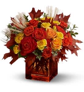 Teleflora's Fine Fall Roses - For a fabulous fall occasion, what could be better than a gift of fresh mixed roses, presented in a Teleflora orange glass cube vase? This fragrant display of orange and yellow roses - accented with natural wheat and oak leaves - makes a great birthday gift. It's autumn-licious!