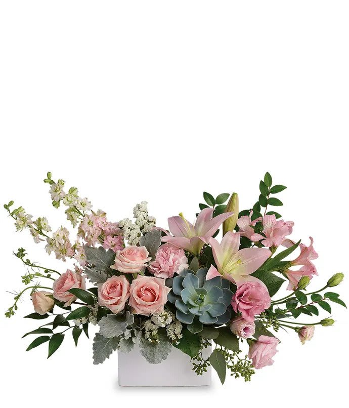 Pink lilies and roses in a white rectangular vase