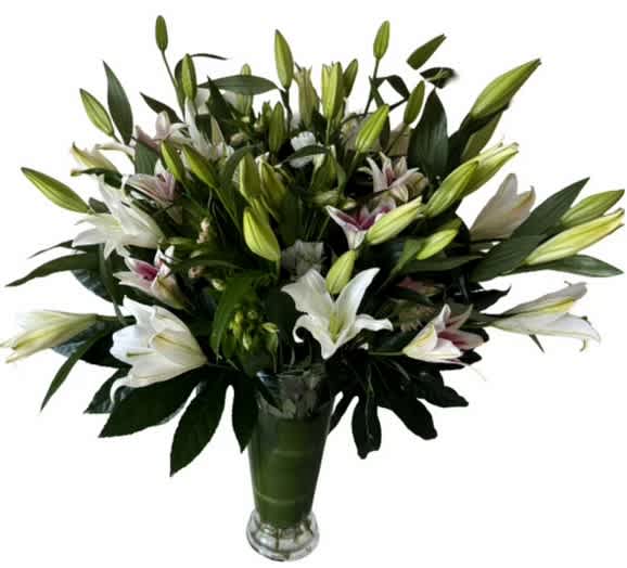 Bouquet of white lilies in a glass vase