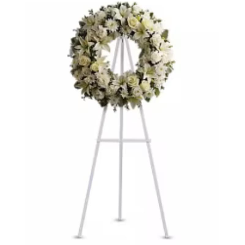 Serenity Wreath - A ring of fragrant bright white blossoms will create a serene display at any funeral or wake. This classic wreath is delivered on an easel and is a thoughtful expression of sympathy and admiration.