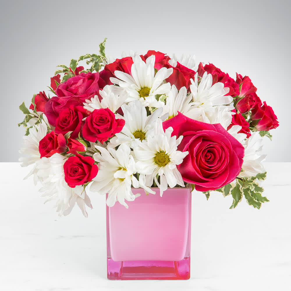 Daisy Me Rollin' by BloomNation - This arrangement contains spray daisies and spray roses. This is a great birthday gift. APPROXIMATE DIMENSIONS: 9"L X 9"W x 9"H