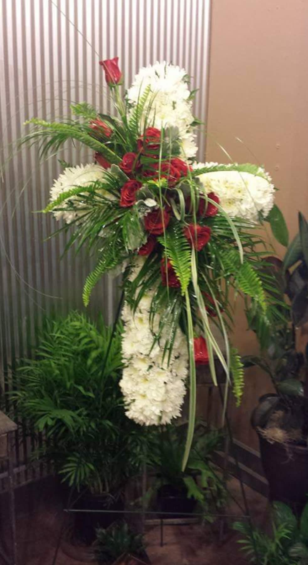 Tall standing floral spray with red roses and white flowers