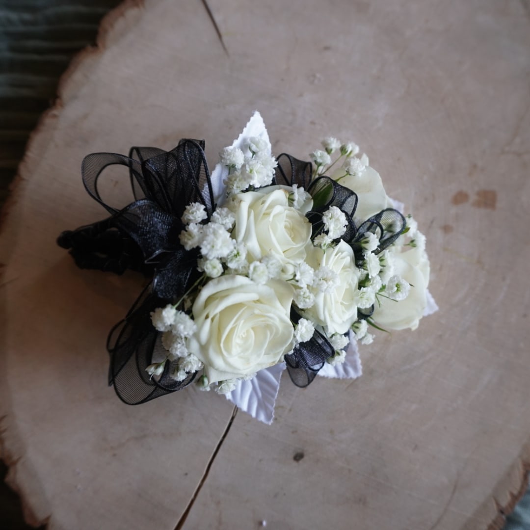 White rose bouquet with black ribbon and baby's breath