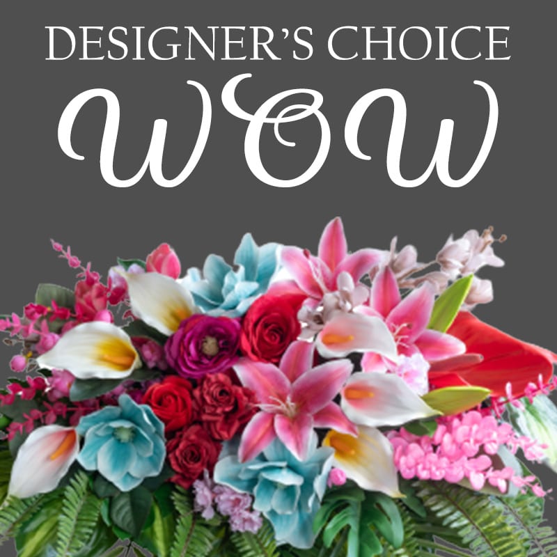 Designer's Choice WOW - Let our designers create a magical arrangement for you. This arrangement will include ROSES! 