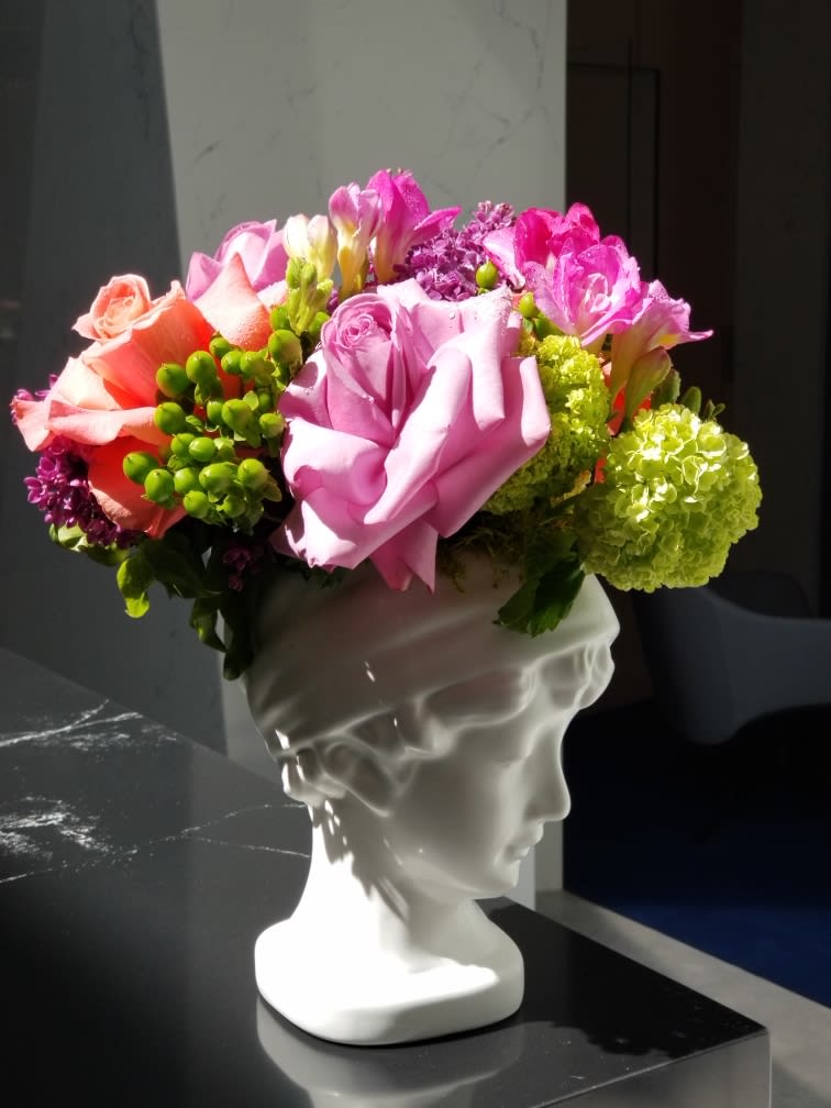 Goddess of Spring - A beautiful arrangement in a ceramic lady container with asst. spring flowers in bloom 