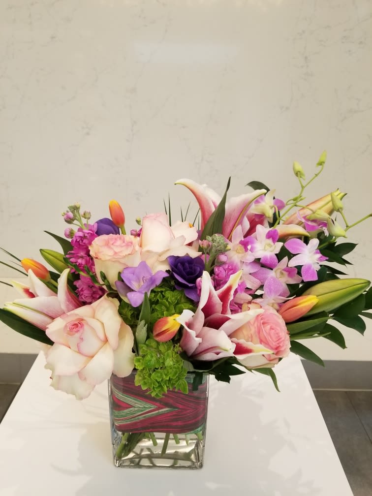 Touch of Elegance - A beautiful, elegant arrangement with a touch of Tropicals. Impressive!