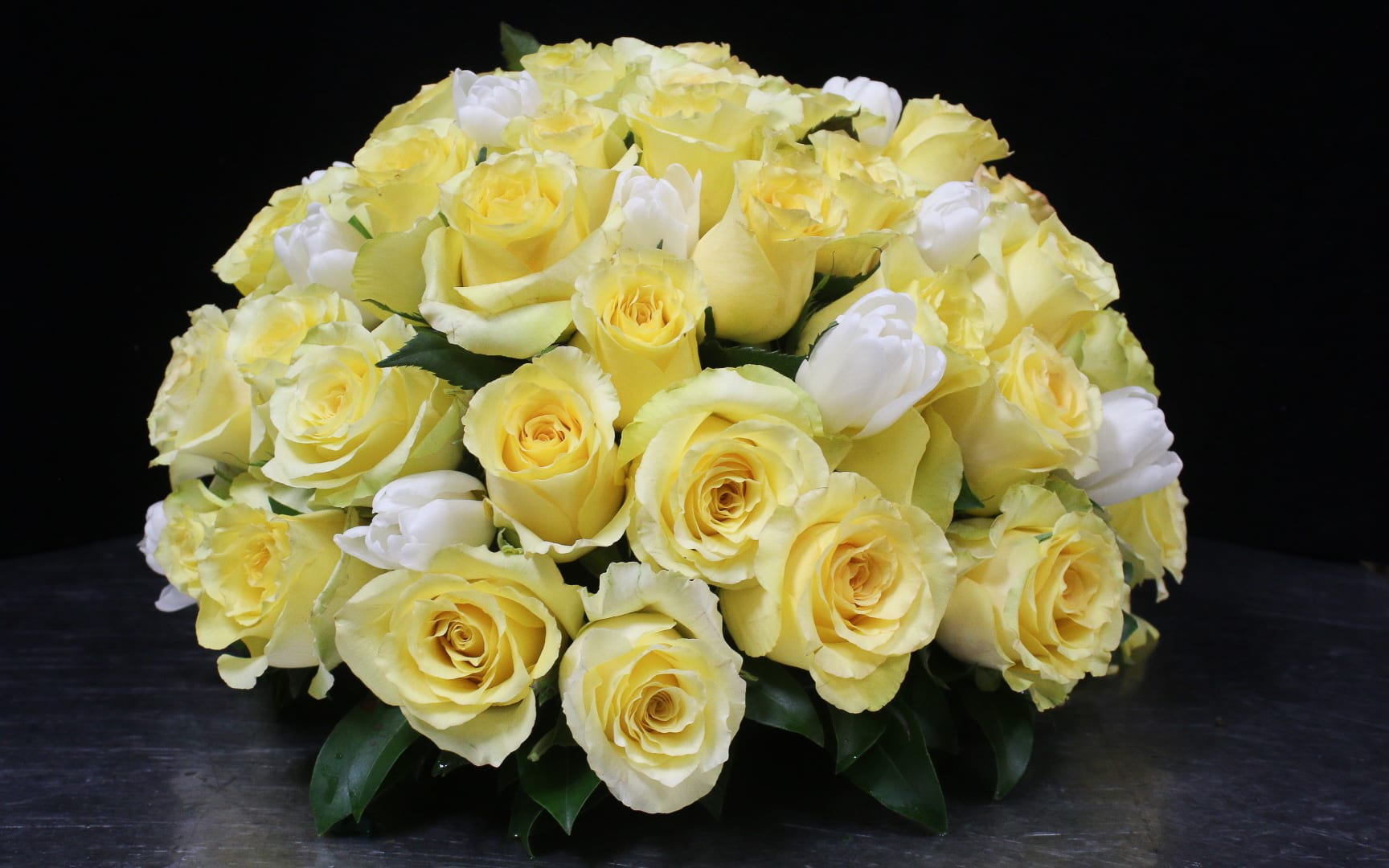 Bouquet of pale yellow roses with white tulips