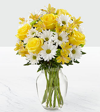 The FTD Sunny Sentiments Bouquet - The FTD Sunny Sentiments Bouquet is a blooming expression of charming cheer. Brilliant yellow roses and Peruvian Lilies are paired with white traditional daisies and green button poms to create a memorable bouquet. Accented with lush greens and arranged in a classic clear glass vase, this bouquet is a wonderful way to celebrate any of life's special moments. GOOD bouquet includes 12 stems. Approx. 16âH x 12âW. BETTER bouquet includes 17 stems. Approx. 17âH x 13âW. BEST bouquet includes 22 stems. Approx. 18âH x 14âW.