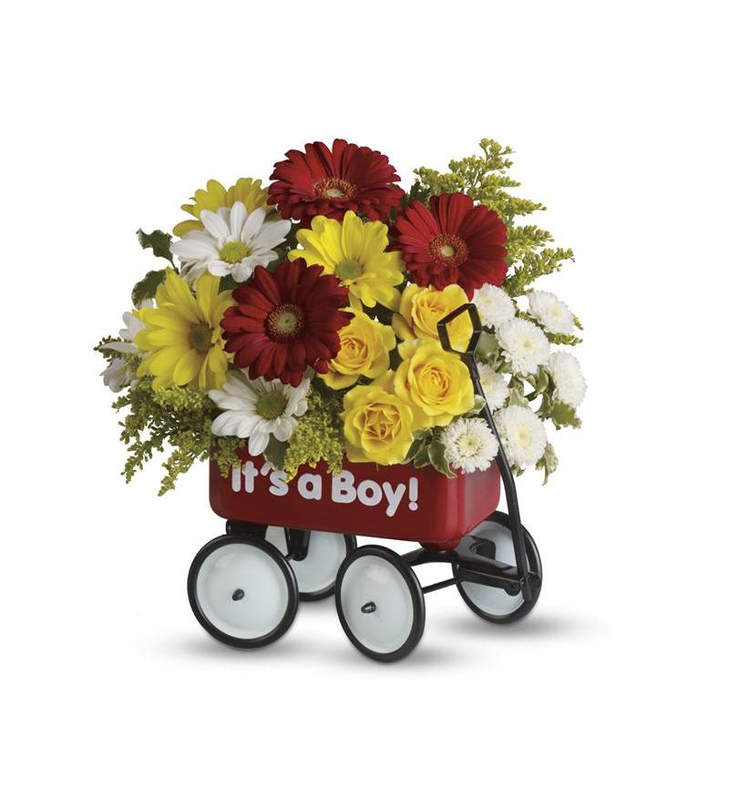 Flower arrangement in a red wagon with "It's a Boy!" text