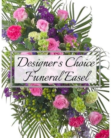 Pink and purple funeral easel spray with roses and carnations