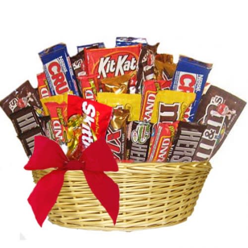 Candies and Chocolates basket - Hand arranged and hand delivered , this candy basket is generously packed with some of America's favorite and famous sweet treats. This gift is perfect for all ages and for almost any occasion! Send today. Please note: contents may var