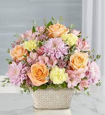 oving Remembrance™ Multicolor Pastel - Celebrate the life of a loved one with our beautiful floral tribute. A mix of blooms in soothing pastel shades is a symbol of enduring love. Designed in our Remembrance Cachepot, featuring an embossed pattern and finished with a gold brushed ivory surface.