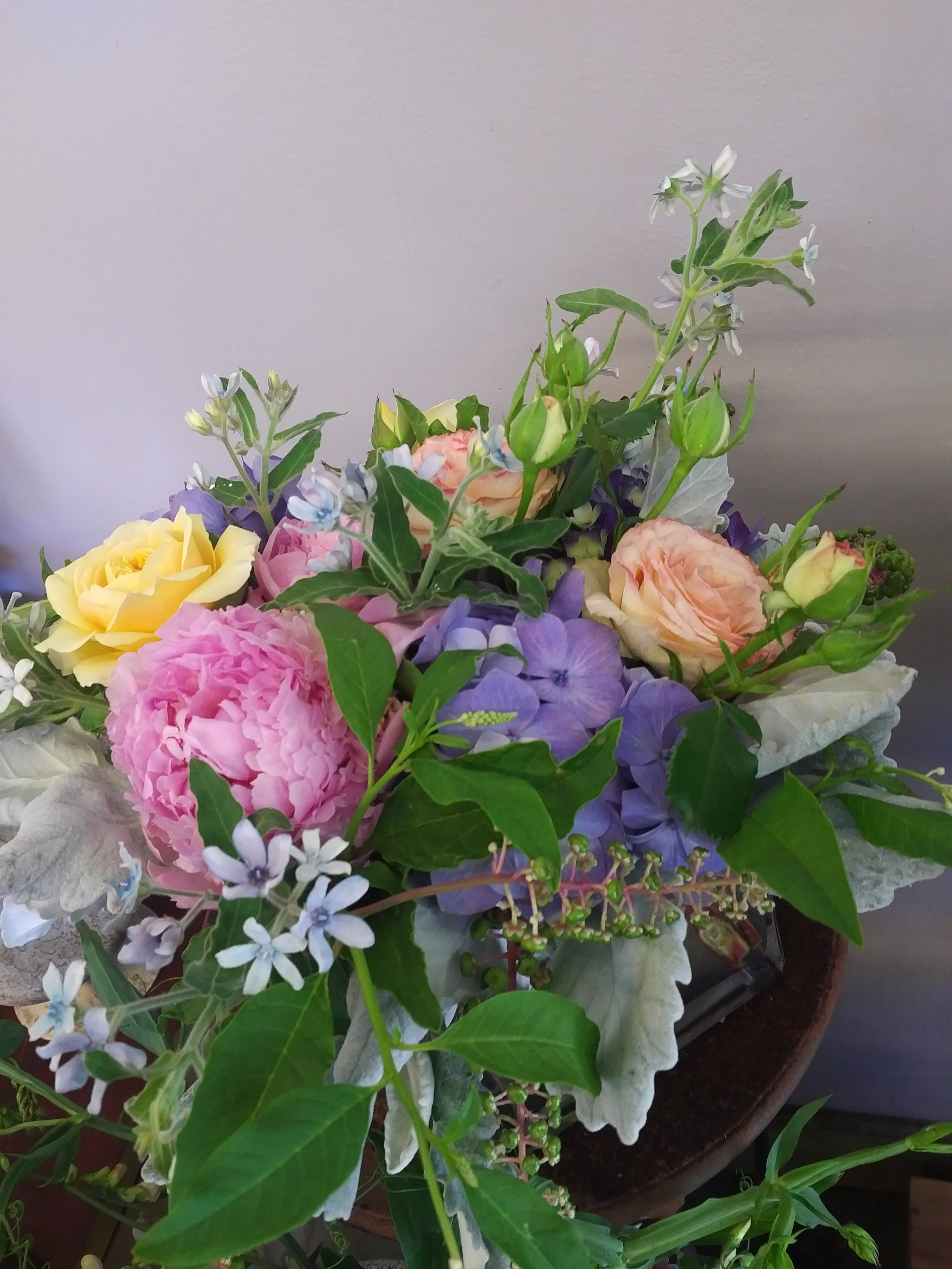 Mixed bouquet with pink, yellow, and lavender flowers