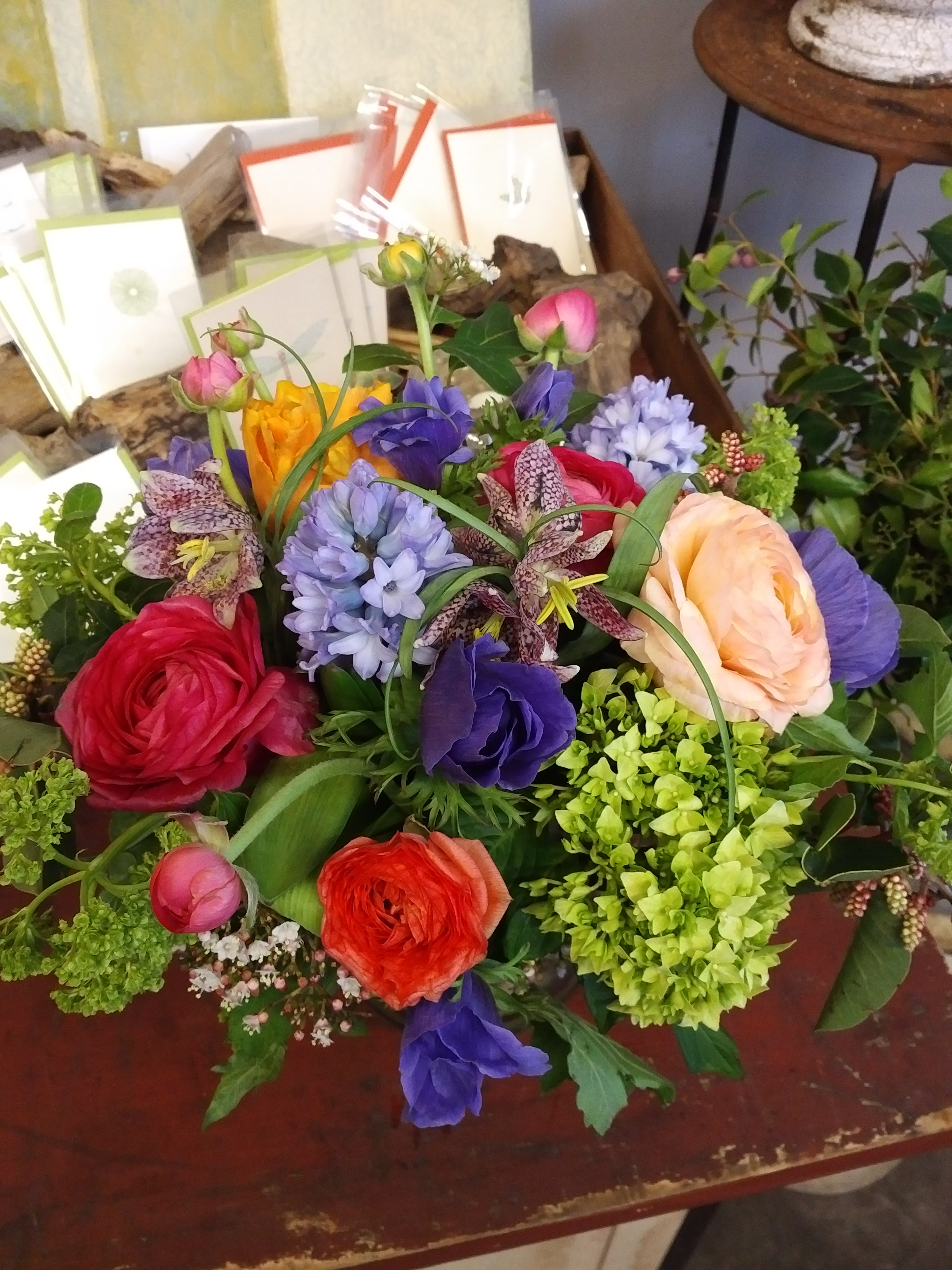 Colorful mixed bouquet with ranunculus, hyacinth, and lilies