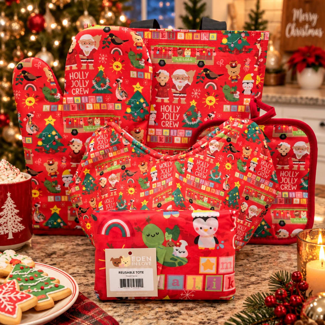 Set of red Christmas tote bags with festive prints on a kitchen counter