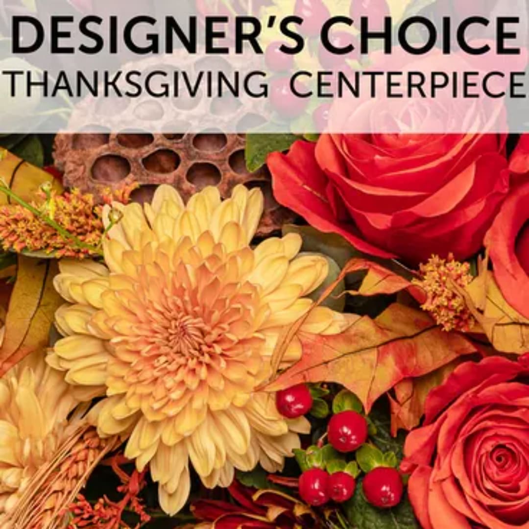 Autumn floral centerpiece with red roses and a large yellow chrysanthemum