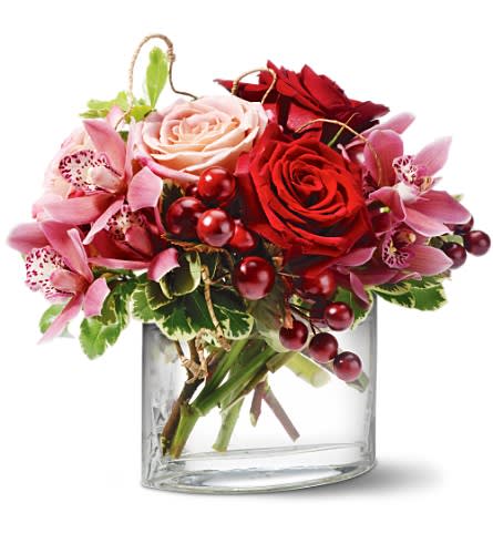 Teleflora's Vineyard Blush - Delectable as rare wine, this elegant floral arrangement, laced with purple artificial grapes, is guaranteed to make any week feel "vintage."