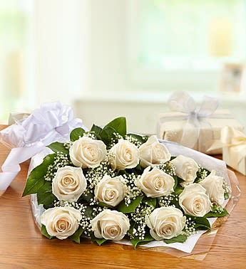 Bouquet of cream roses with baby's breath and white ribbon