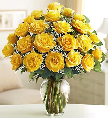 Yellow roses arranged in a clear glass vase