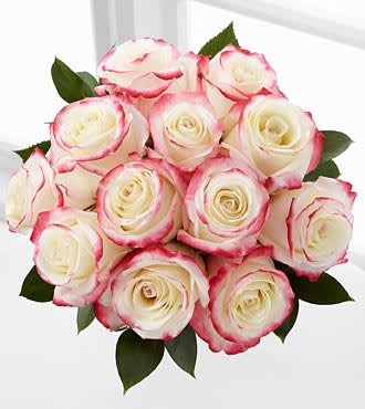 Bouquet of white roses with pink-edged petals