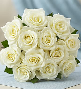 Bouquet of white roses with green leaves