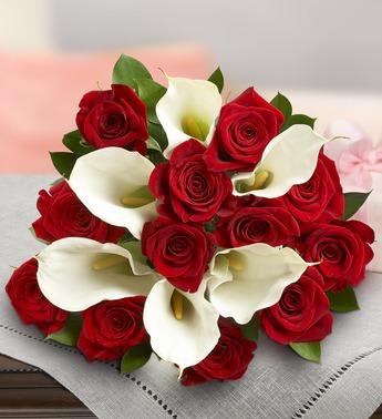 Bouquet of red roses and white calla lilies