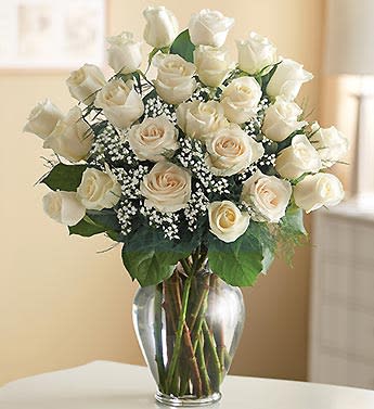 Bouquet of white roses in a clear glass vase