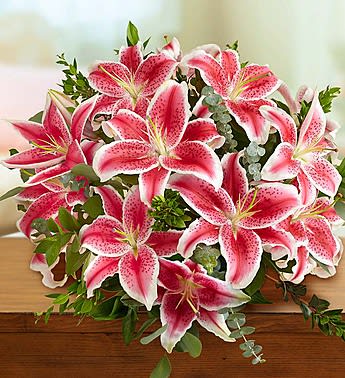 Bouquet of pink stargazer lilies with greenery