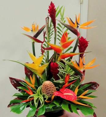 Tropical bouquet with orange bird-of-paradise flowers and red ginger blooms