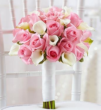 Pink rose and white calla lily bouquet on a chair