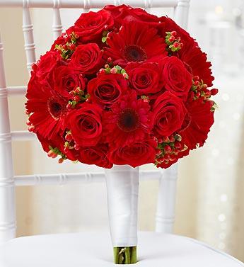 Red rose and gerbera daisy bouquet on a white chair