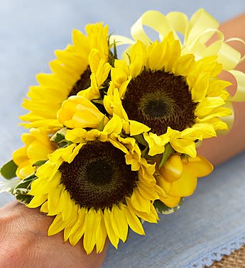 Yellow sunflower wrist corsage with ribbon