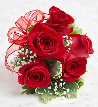 Bouquet of red roses with baby’s breath and a red ribbon