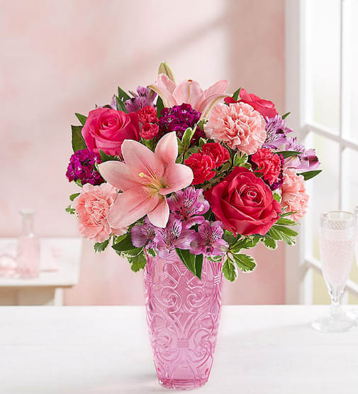 Pink and red mixed bouquet in a pink vase