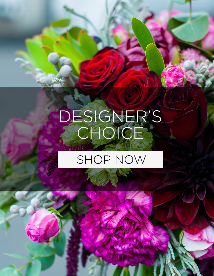 Mixed bouquet with red roses and bright pink flowers
