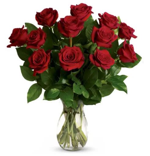 Bouquet of red roses in a clear glass vase