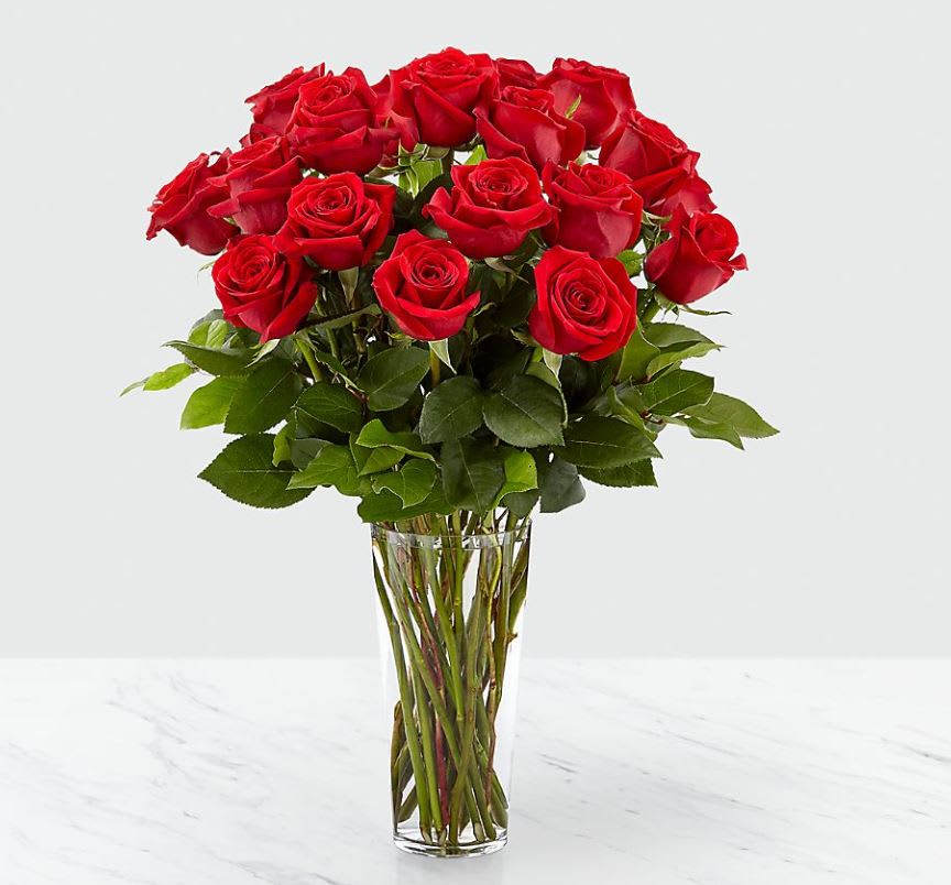 The FTD Long Stem Red Rose Bouquet - Nothing speaks of love so much as a bouquet of beautiful long stem red roses. Arranged in a classic glass vase, this bouquet is a gift to her heart from yours.  