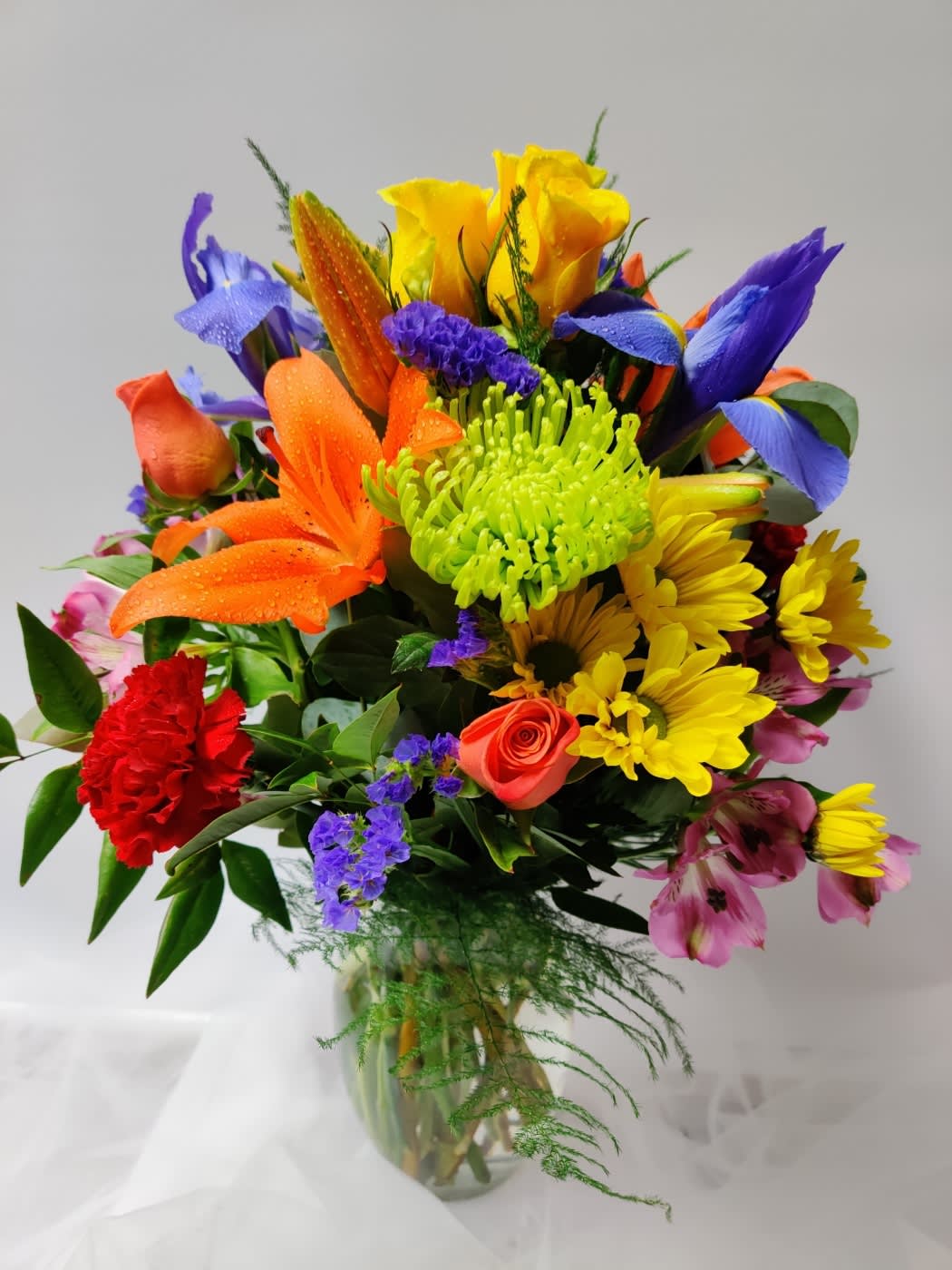 Colorful mixed bouquet in a clear glass vase