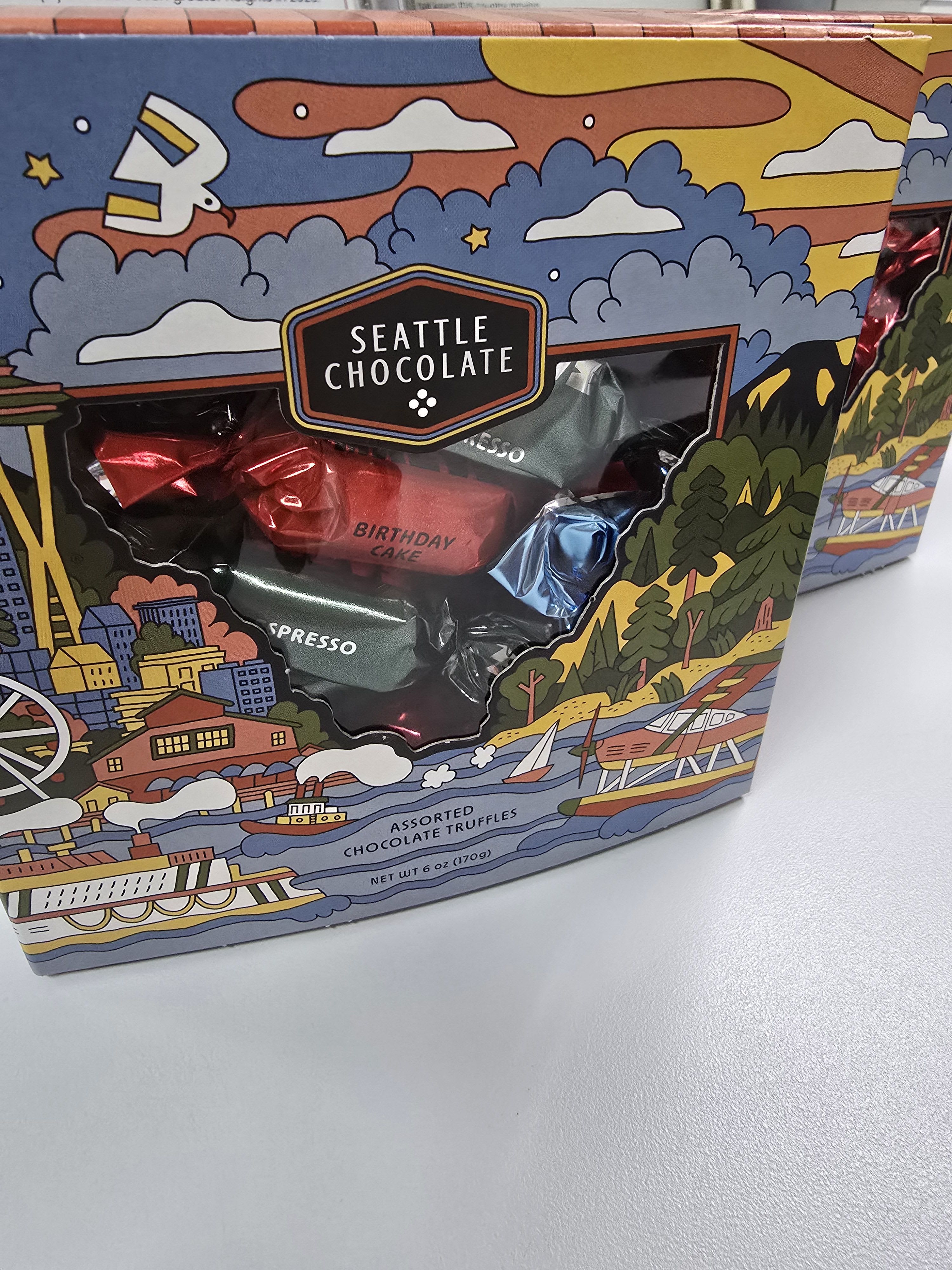 Box of Seattle Chocolate assorted truffles with colorful city-themed packaging