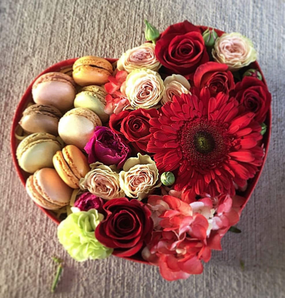 Heart-shaped box with roses, gerbera daisy, and macarons