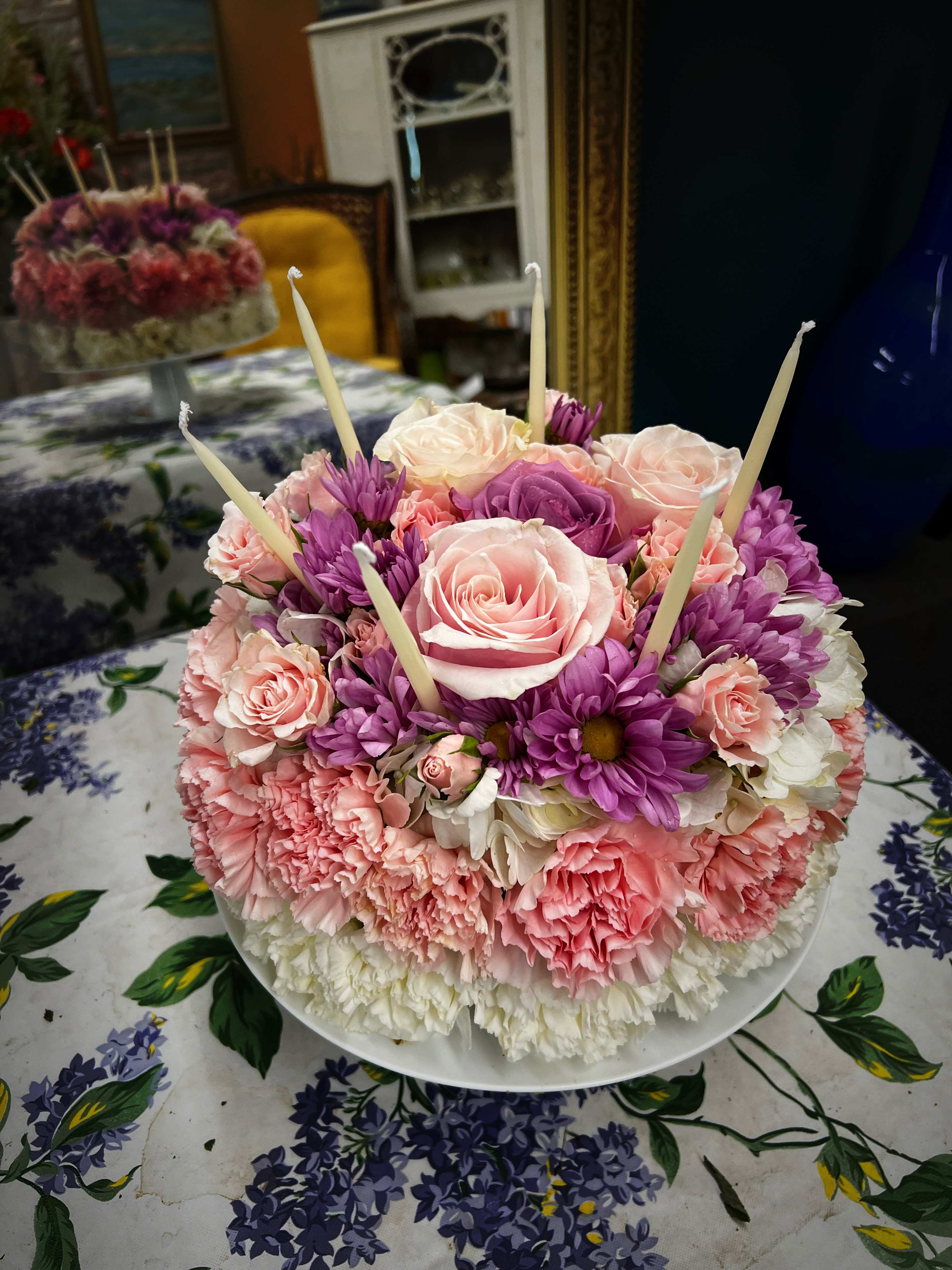 Floral Birthday Cake - Assortment of pastel flowers designed as a Birthday Cake includes candles and a pedestal cake plate. 