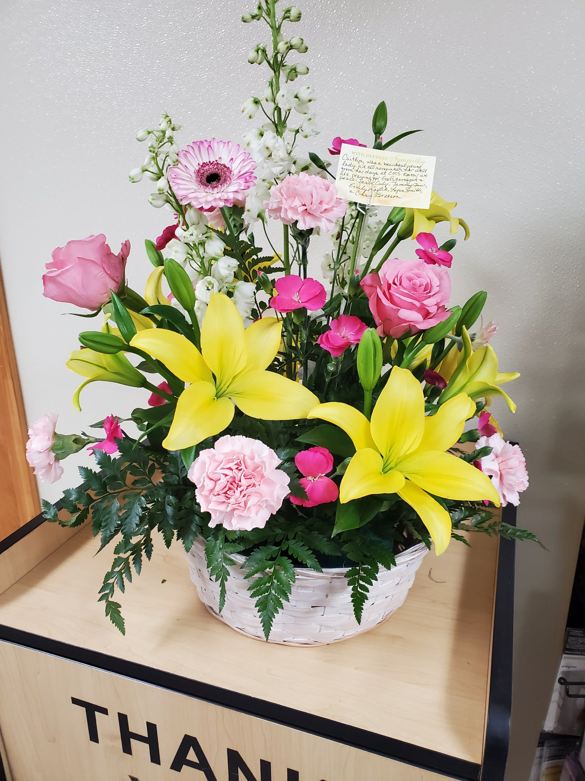 White Wicker Basket with Assortment of Flowers - Yellow Lilies, Pink Roses, etc
