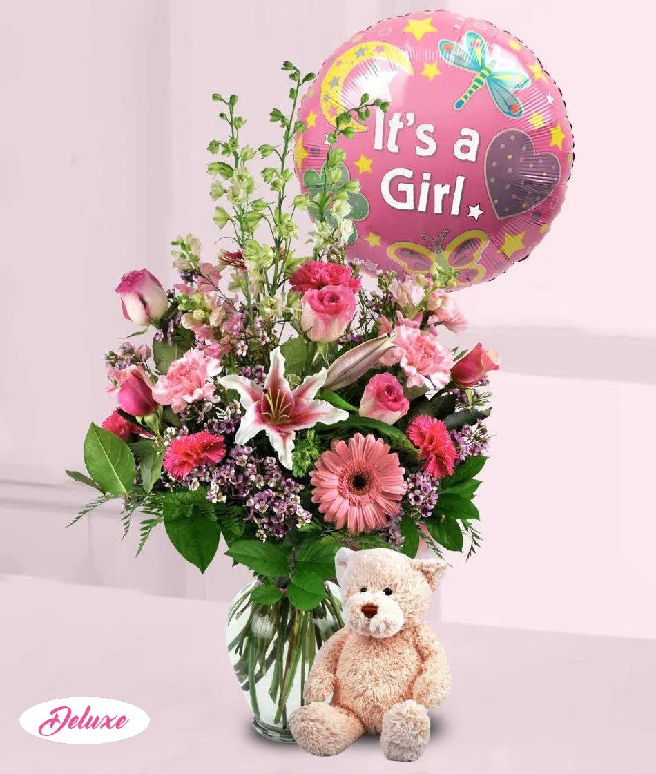 Pink mixed flower bouquet with a "It's a Girl" balloon and teddy bear