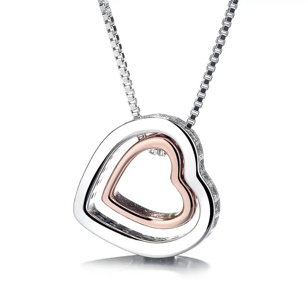 Heart-shaped silver pendant necklace with a rose gold inner heart