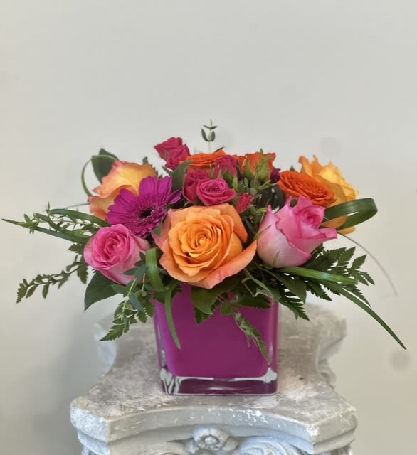 Euphoria by Westford Florist Art by Veny - Unleash your senses with Euphoria by Westford Florist Art by Veny. This stunning floral masterpiece weaves together delicate roses, vibrant gerberas, and cheerful spray roses, all elegantly intertwined with lush lily grass and verdant greenery. Each bloom dances in perfect harmony, creating a visual symphony that instantly uplifts the spirit. Whether gracing your home or brightening someone's day, this enchanting arrangement is more than just flowers—it's an invitation to bask in joy and celebrate life's beautiful moments. Let Euphoria be the breath of fresh air that transforms any space into a haven of happiness!