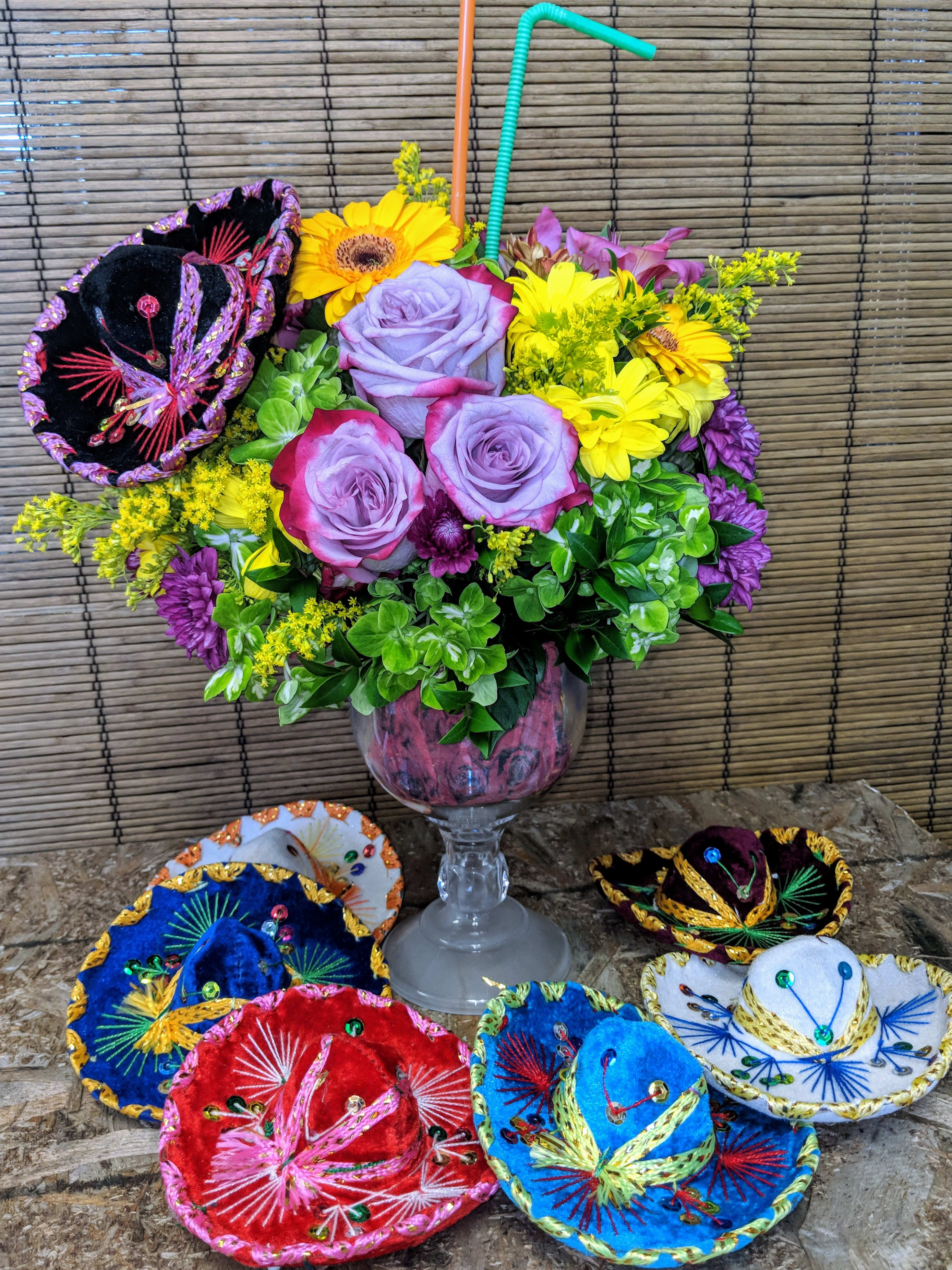 Fiesta! by VNFlowers - Happy Flowers in a Glass vase with Sombrero makes for a fun evening ! Let us design one for you !!  All sombreros are different along with the flower choices .
