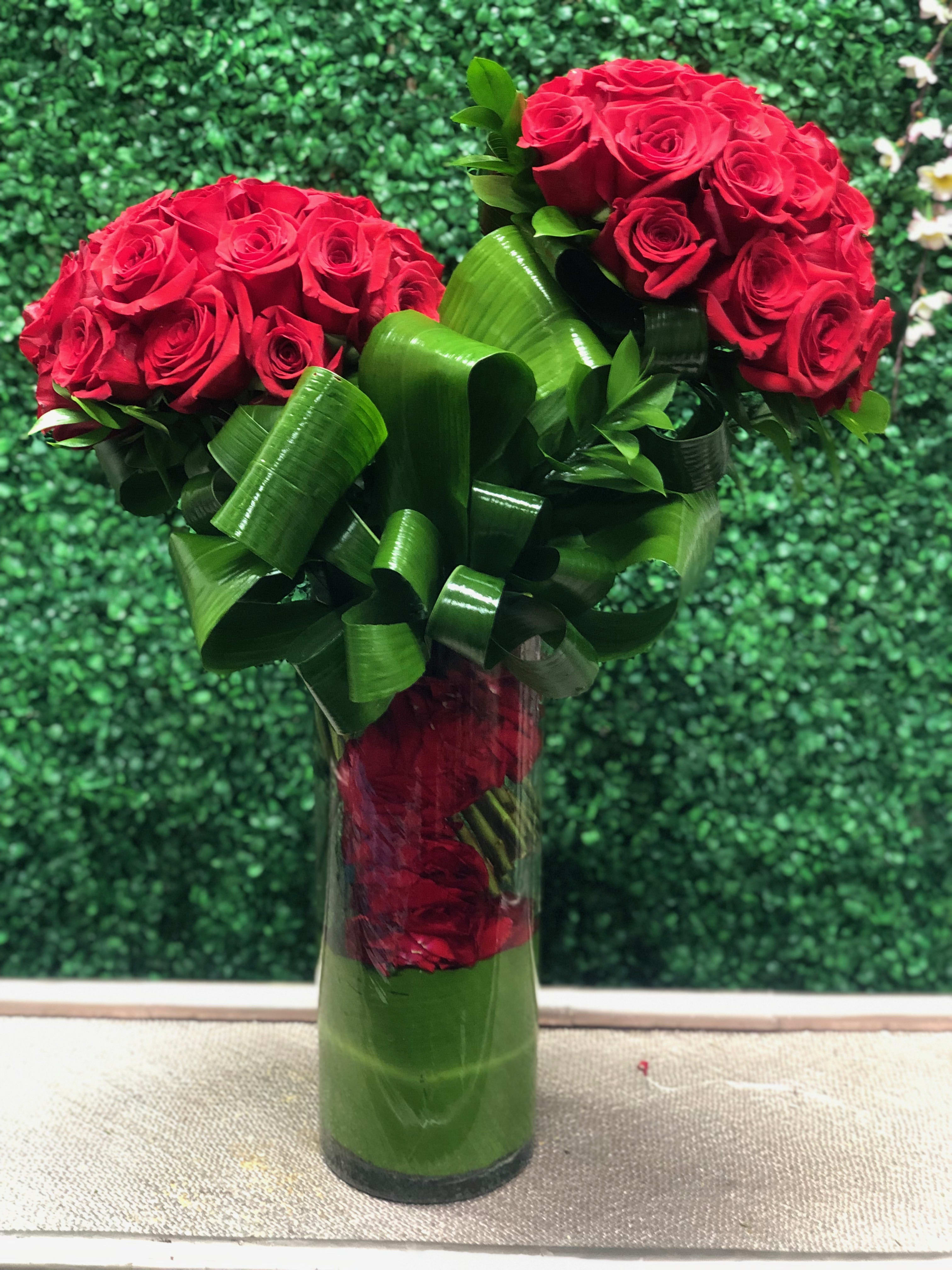 A FEW DOZEN WAYS TO LOVE YOU - TALL MODERN FLORAL WITH AT LEAST 24 ROSES IN A MODERN DESIGN WITH ROSE PETALS INSIDE THE VASE CAN BE MADE WITH ANY COLOR ROSES