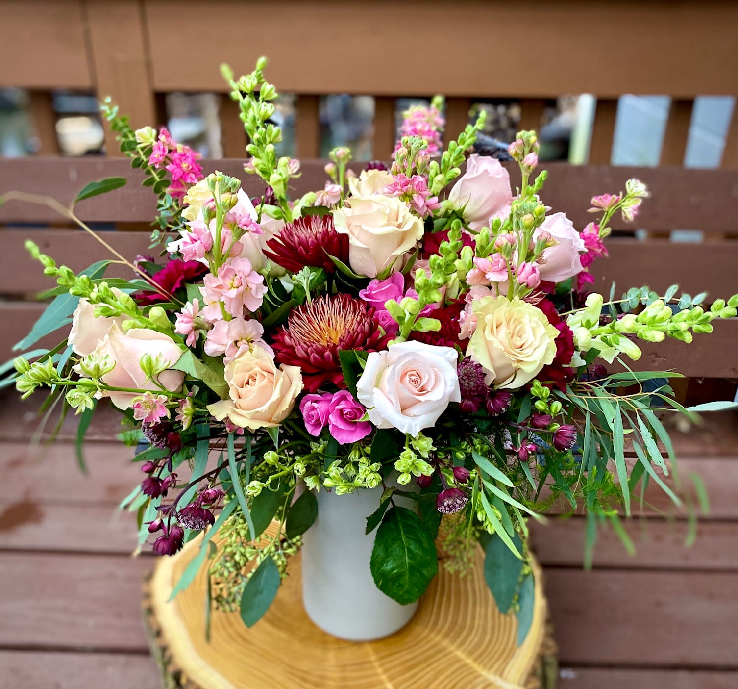 YOU are so SPECIAL - Oh, no doubt there is that one person who is so special in your life! This flower bouquet is for her/him! Cheerful and joyous, lush and simple at the same time! Perfect for any occasion let it be a special birthday or Anniversary, or Just Because! Make someone dear to you feel so much SPECIAL!  - Roses (color shade may be slightly different based upon availability) - Stock - Carnations - Mums - Snapdragon and/or Larkspur (based upon availability) - Greens  * Comes arranged in a tall gray ceramic vase.