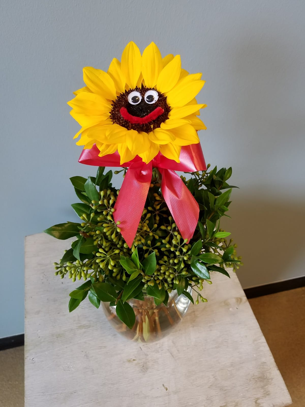 Smiley - Sunflower and eucalyptus in fish bowl